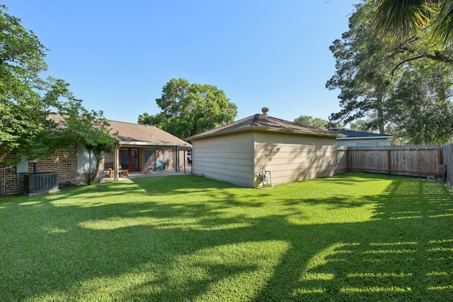 1410 Saxony Ln, Nassau Bay, TX 77058 - view of yard with central air condition unit and a patio area