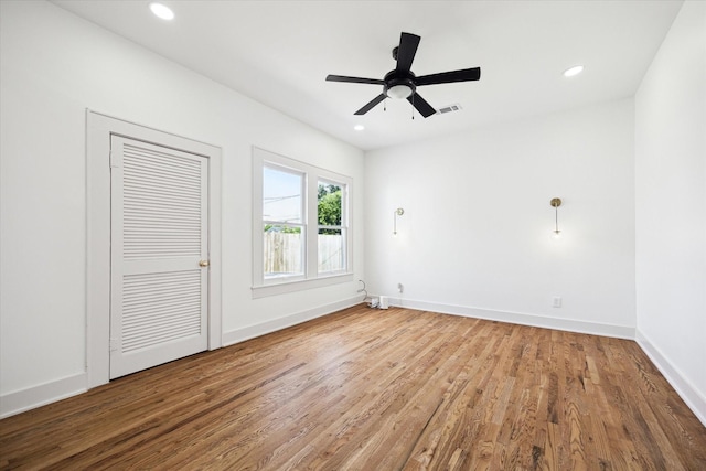 1546 Lawson St, Houston, TX 77023 - empty room with wood finished floors, baseboards, ceiling fan, and recessed lighting