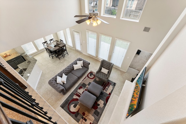 27935 Chiapas Dr, Spring, TX 77386 - tiled living room featuring a towering ceiling, plenty of natural light, and a ceiling fan