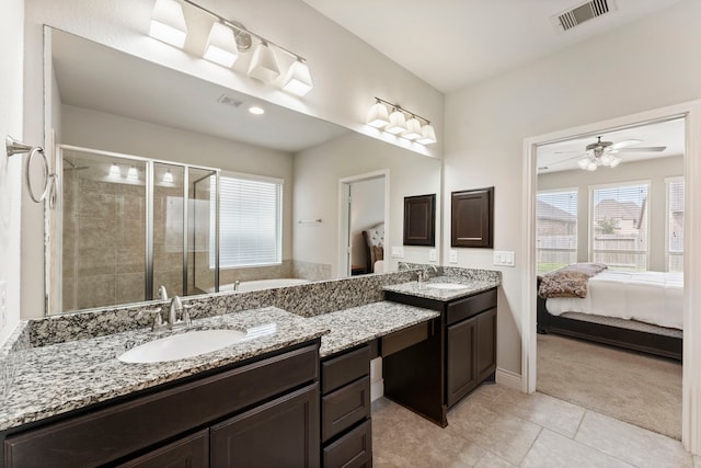 27935 Chiapas Dr, Spring, TX 77386 - full bath featuring ensuite bathroom, a stall shower, two vanities, a garden tub, and tile patterned flooring