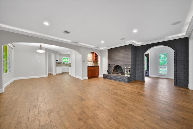 12443 Honeywood Trl, Houston, TX 77077 - unfurnished living room with a fireplace, light wood-style floors, baseboards, and recessed lighting