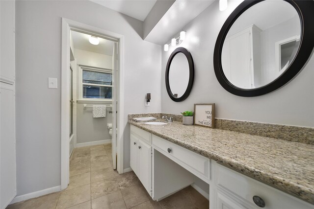12443 Honeywood Trl, Houston, TX 77077 - bathroom featuring vanity, baseboards, toilet, and tile patterned flooring