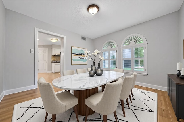 12443 Honeywood Trl, Houston, TX 77077 - dining space with baseboards and light wood-type flooring