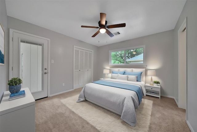 12443 Honeywood Trl, Houston, TX 77077 - bedroom featuring light carpet, baseboards, a closet, and a ceiling fan