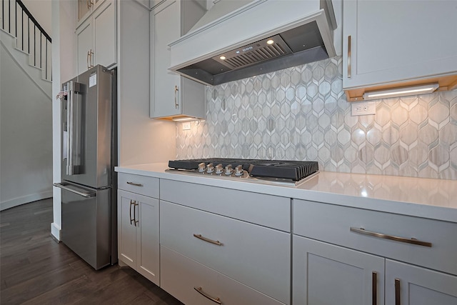 29851 Aaron River Trl, Fulshear, TX 77441 - kitchen featuring premium range hood, appliances with stainless steel finishes, dark wood finished floors, and light countertops