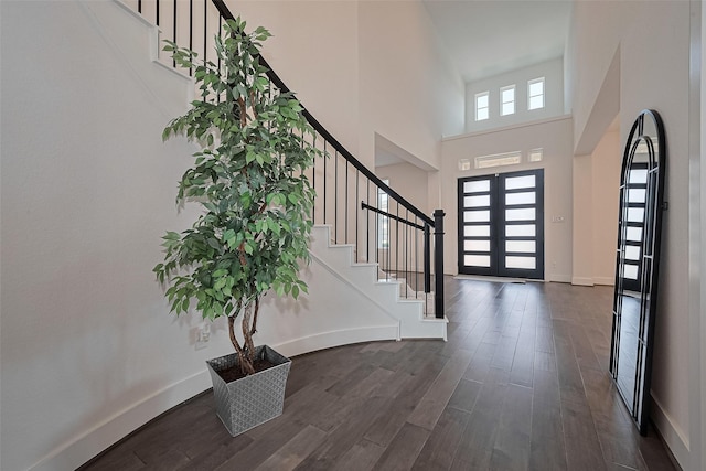 29851 Aaron River Trl, Fulshear, TX 77441 - entrance foyer with stairs, dark wood-style floors, baseboards, and a towering ceiling