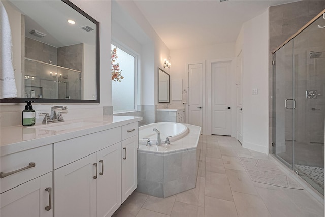 29851 Aaron River Trl, Fulshear, TX 77441 - bathroom with a shower stall, a garden tub, tile patterned floors, and two vanities