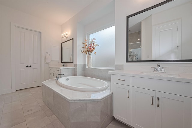 29851 Aaron River Trl, Fulshear, TX 77441 - bathroom featuring a garden tub, tile patterned flooring, two vanities, and a shower