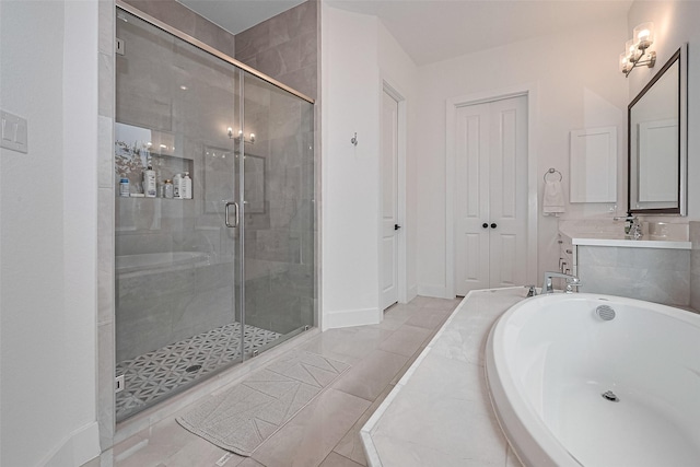 29851 Aaron River Trl, Fulshear, TX 77441 - bathroom featuring a stall shower, a tub to relax in, vanity, and baseboards