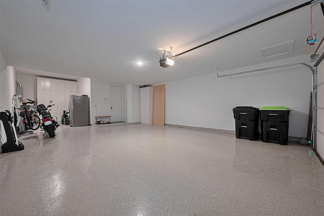29851 Aaron River Trl, Fulshear, TX 77441 - garage featuring freestanding refrigerator and a garage door opener