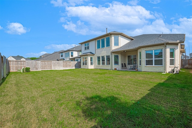 29851 Aaron River Trl, Fulshear, TX 77441 - rear view of property with roof with shingles and a patio area