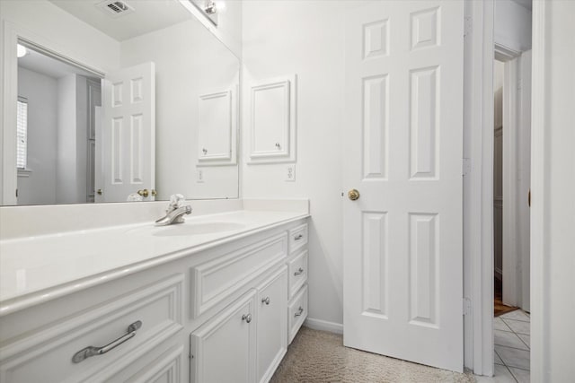 bathroom featuring vanity and tile patterned flooring