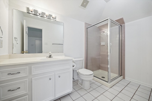 full bathroom featuring tile patterned floors, a shower stall, toilet, vanity, and lofted ceiling