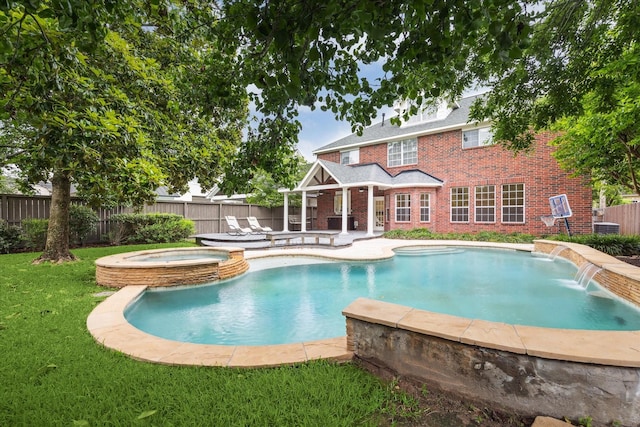 view of pool featuring a patio area and a pool with connected hot tub