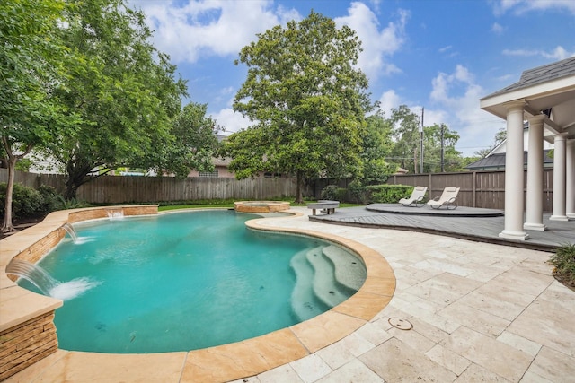 view of pool with a deck, a fenced backyard, and a patio