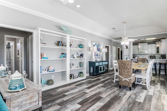 2296 Martinique, Crystal Beach, TX 77650 - dining room featuring a ceiling fan, wood finished floors, crown molding, vaulted ceiling, and recessed lighting