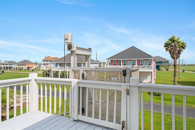 2296 Martinique, Crystal Beach, TX 77650 - wooden terrace with a yard and a residential view