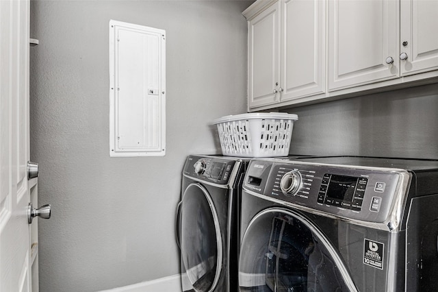 2296 Martinique, Crystal Beach, TX 77650 - laundry room with electric panel, cabinet space, and washing machine and dryer