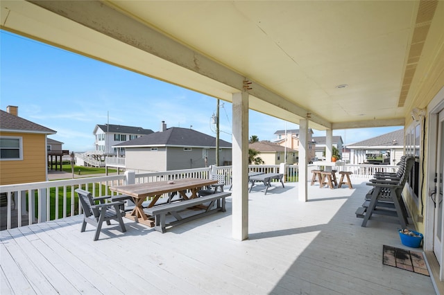 2296 Martinique, Crystal Beach, TX 77650 - wooden deck with outdoor dining space and a residential view