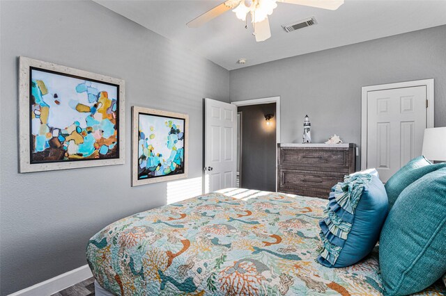 2296 Martinique, Crystal Beach, TX 77650 - bedroom with baseboards, wood finished floors, and a ceiling fan