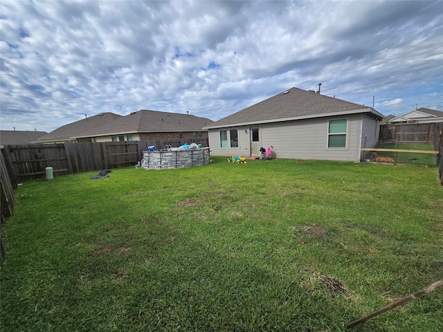 9810 Archdale Spring Dr, Baytown, TX 77521 - rear view of property featuring a pool and roof with shingles