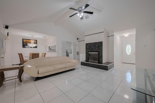 living area with light tile patterned floors, a large fireplace, and ceiling fan