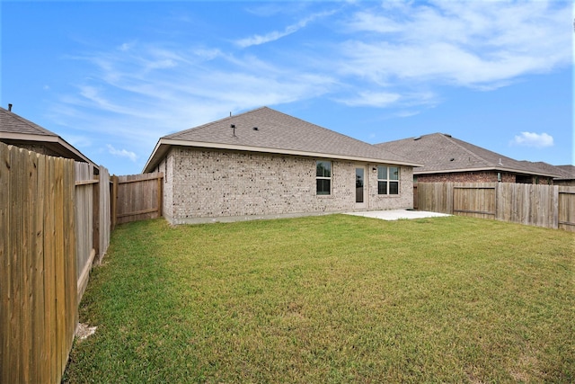 4401 E Bayou Maison Cir, Dickinson, TX 77539 - back of house featuring a patio area, brick siding, and a shingled roof