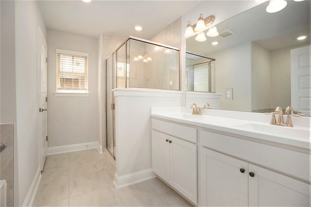 4401 E Bayou Maison Cir, Dickinson, TX 77539 - full bath with a stall shower, double vanity, baseboards, and recessed lighting