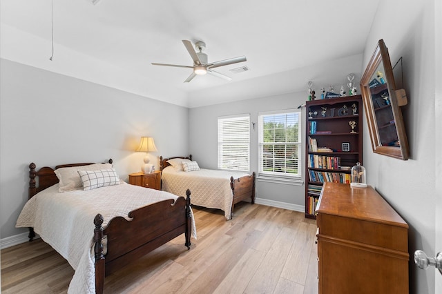 13502 Mount Airy Dr, Cypress, TX 77429 - bedroom with light wood-style flooring, baseboards, and ceiling fan