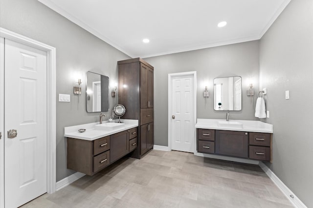 13502 Mount Airy Dr, Cypress, TX 77429 - full bathroom with baseboards, two vanities, ornamental molding, and recessed lighting