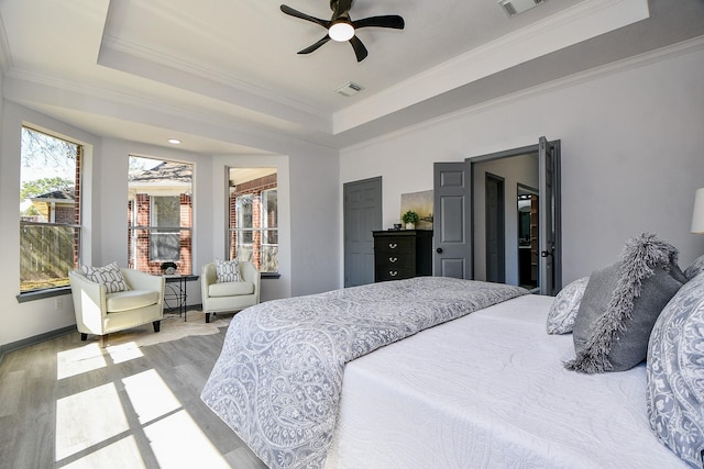 20011 Polly Creek Way, Katy, TX 77450 - bedroom with a tray ceiling, wood finished floors, ornamental molding, baseboards, and a ceiling fan