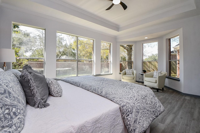 20011 Polly Creek Way, Katy, TX 77450 - bedroom featuring ornamental molding, wood finished floors, a tray ceiling, baseboards, and a ceiling fan