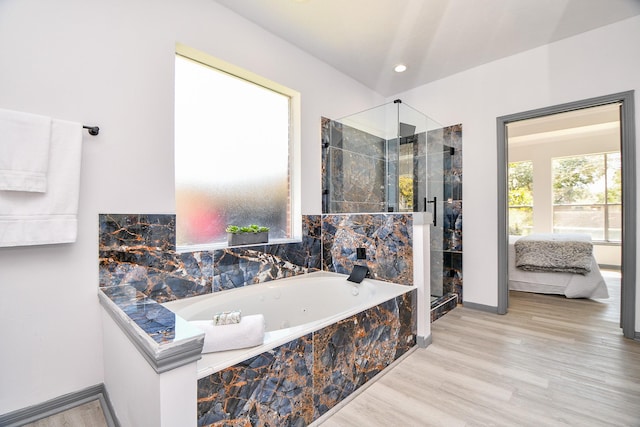 20011 Polly Creek Way, Katy, TX 77450 - full bathroom featuring a shower stall, a jetted tub, baseboards, ensuite bathroom, and wood finished floors