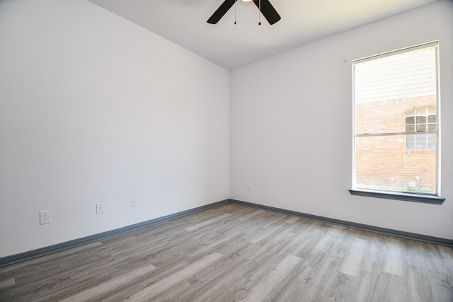 20011 Polly Creek Way, Katy, TX 77450 - unfurnished room featuring wood finished floors, ceiling fan, plenty of natural light, and baseboards