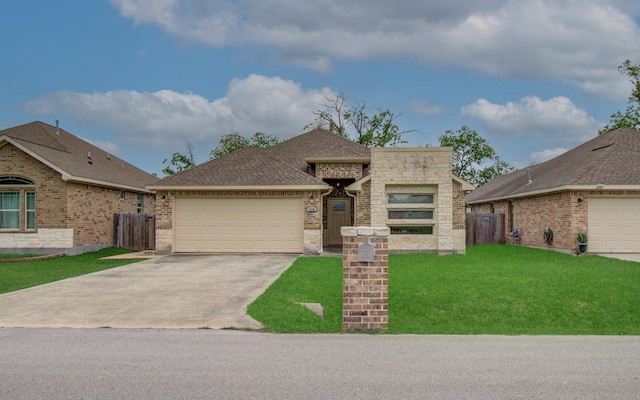 114 Dr Martin Luther King Jr Dr, La Porte, TX 77571 - view of front of home featuring a garage, concrete driveway, stone siding, brick siding, and a shingled roof