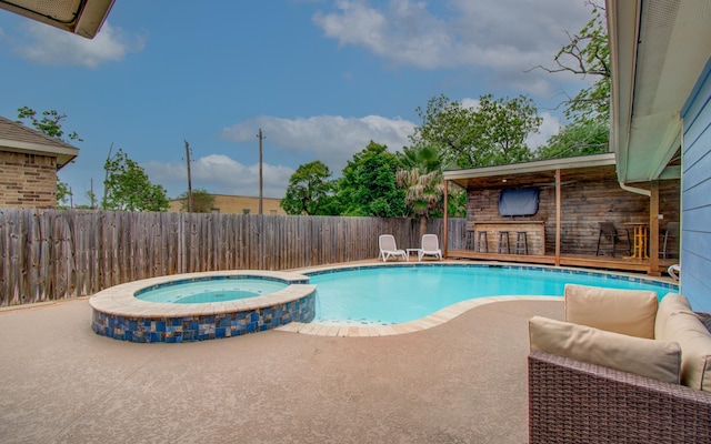 114 Dr Martin Luther King Jr Dr, La Porte, TX 77571 - view of swimming pool with a patio area, a fenced backyard, and a pool with connected hot tub