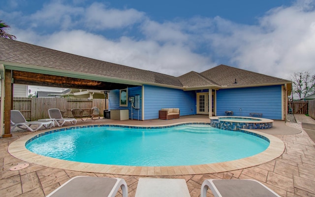 114 Dr Martin Luther King Jr Dr, La Porte, TX 77571 - view of swimming pool with a patio area, a fenced backyard, a pool with connected hot tub, and french doors