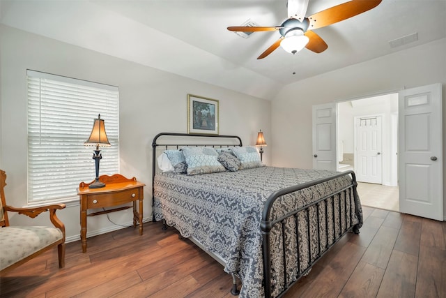 bedroom with hardwood / wood-style flooring, vaulted ceiling, baseboards, and ceiling fan