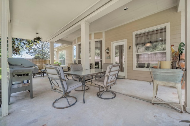 view of patio / terrace with outdoor dining space and fence