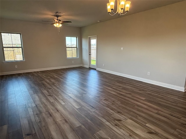 4329 W Bayou Maison Cir, Dickinson, TX 77539 - spare room featuring a chandelier, dark wood-style floors, baseboards, and a ceiling fan
