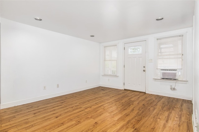 1614 Ursuline St, Galveston, TX 77550 - foyer featuring cooling unit, wood finished floors, baseboards, and recessed lighting