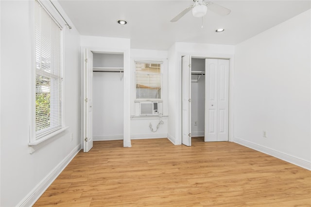 1614 Ursuline St, Galveston, TX 77550 - unfurnished bedroom with two closets, light wood-style flooring, baseboards, cooling unit, and recessed lighting