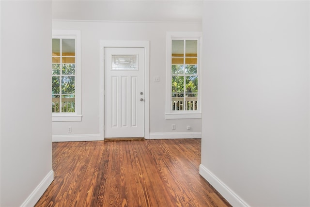 1614 Ursuline St, Galveston, TX 77550 - entrance foyer with wood finished floors, baseboards, and ornamental molding