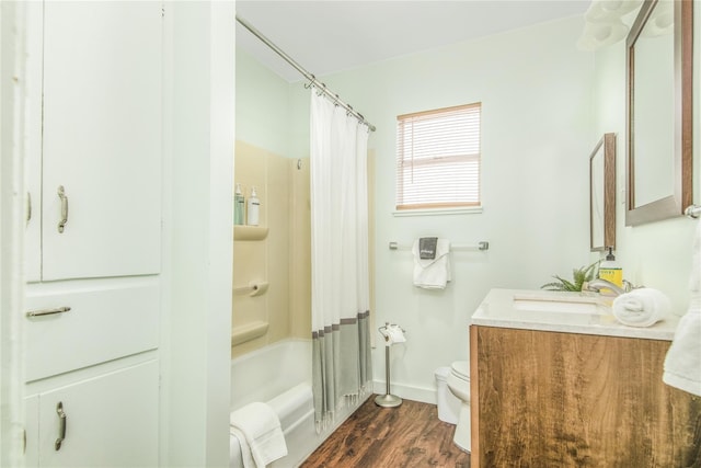 1614 Ursuline St, Galveston, TX 77550 - bathroom with wood finished floors, toilet, vanity, shower / bathtub combination with curtain, and baseboards