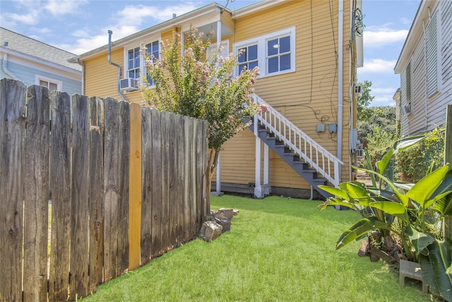 1614 Ursuline St, Galveston, TX 77550 - rear view of house featuring stairway and cooling unit