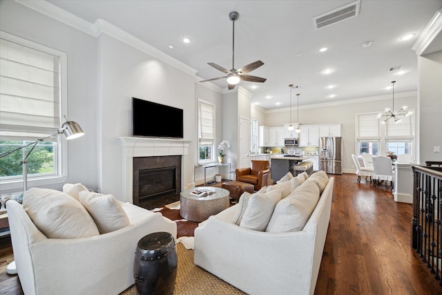 2729 Cohn St, Houston, TX 77007 - living room featuring ornamental molding, a fireplace with flush hearth, recessed lighting, dark wood-type flooring, and ceiling fan