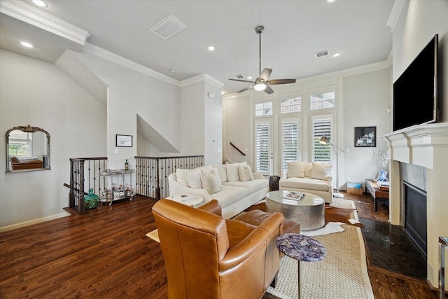 2729 Cohn St, Houston, TX 77007 - living room featuring crown molding, a ceiling fan, dark wood-style floors, recessed lighting, and a premium fireplace