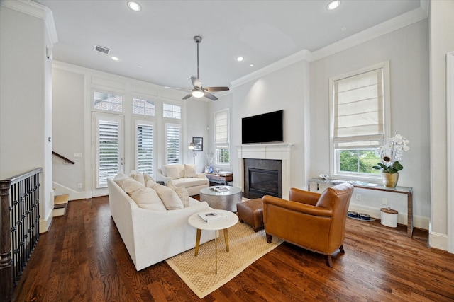 2729 Cohn St, Houston, TX 77007 - living room with crown molding, a glass covered fireplace, dark wood-style flooring, recessed lighting, and a ceiling fan