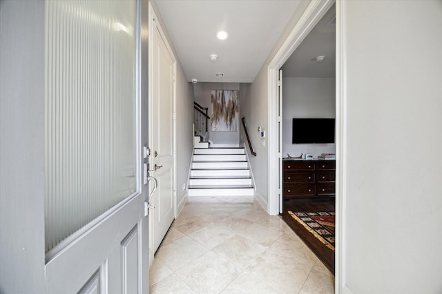 2729 Cohn St, Houston, TX 77007 - hall featuring stairway, baseboards, and light tile patterned floors
