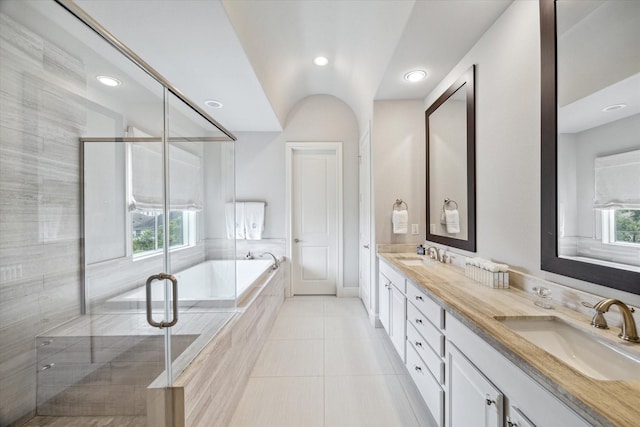 2729 Cohn St, Houston, TX 77007 - bathroom featuring a shower stall, double vanity, a bath, tile patterned floors, and recessed lighting